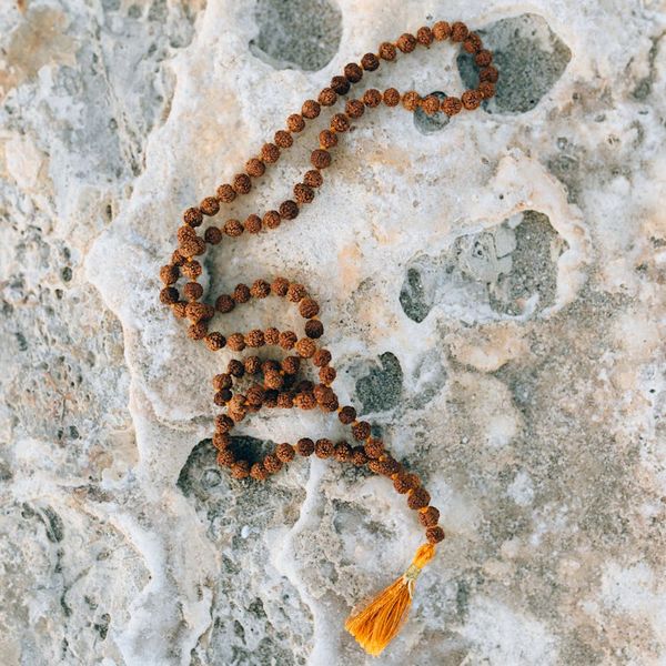 Person in a balanced yoga stance against a calming dark background.